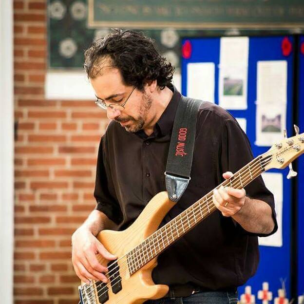 Rodrigo playing bass at a recital